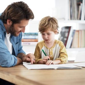 man teaching young boy